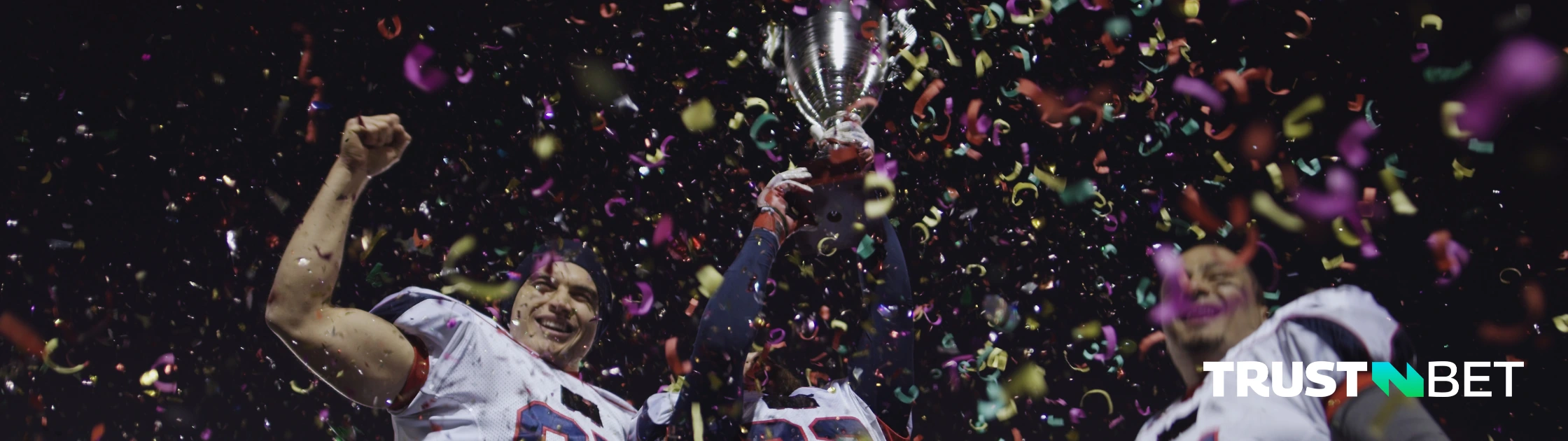 Winning team in American football with their trophy and celebration.